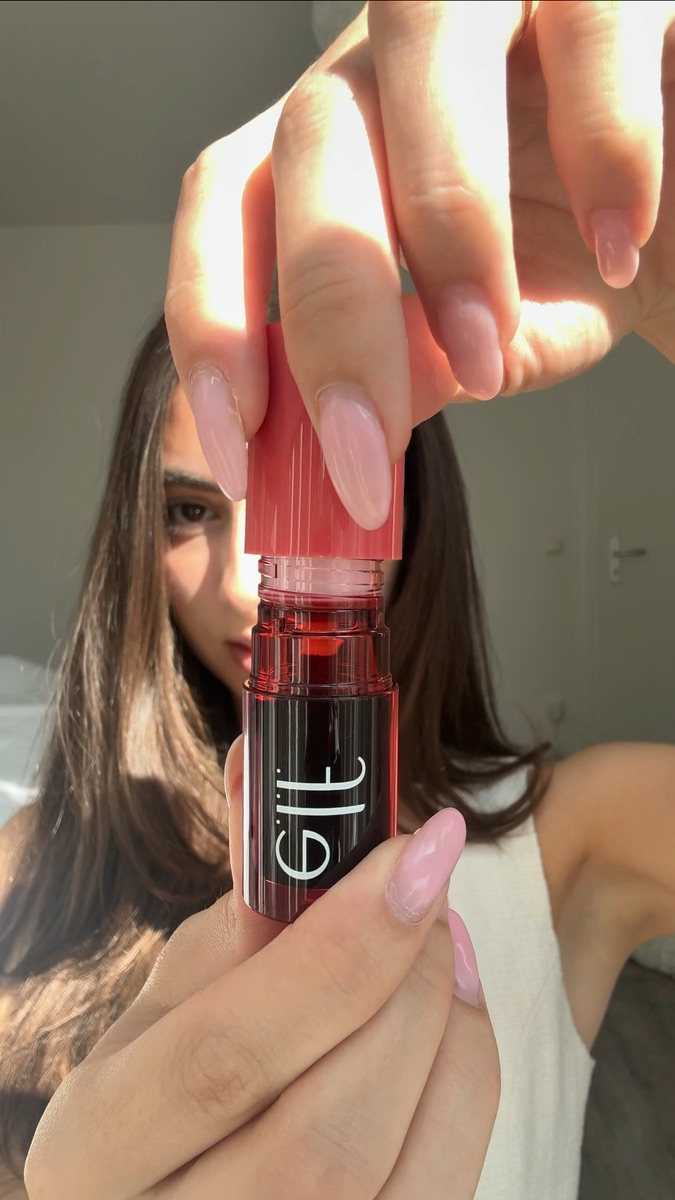 e.l.f. Cosmetics lip oil held in front of the camera